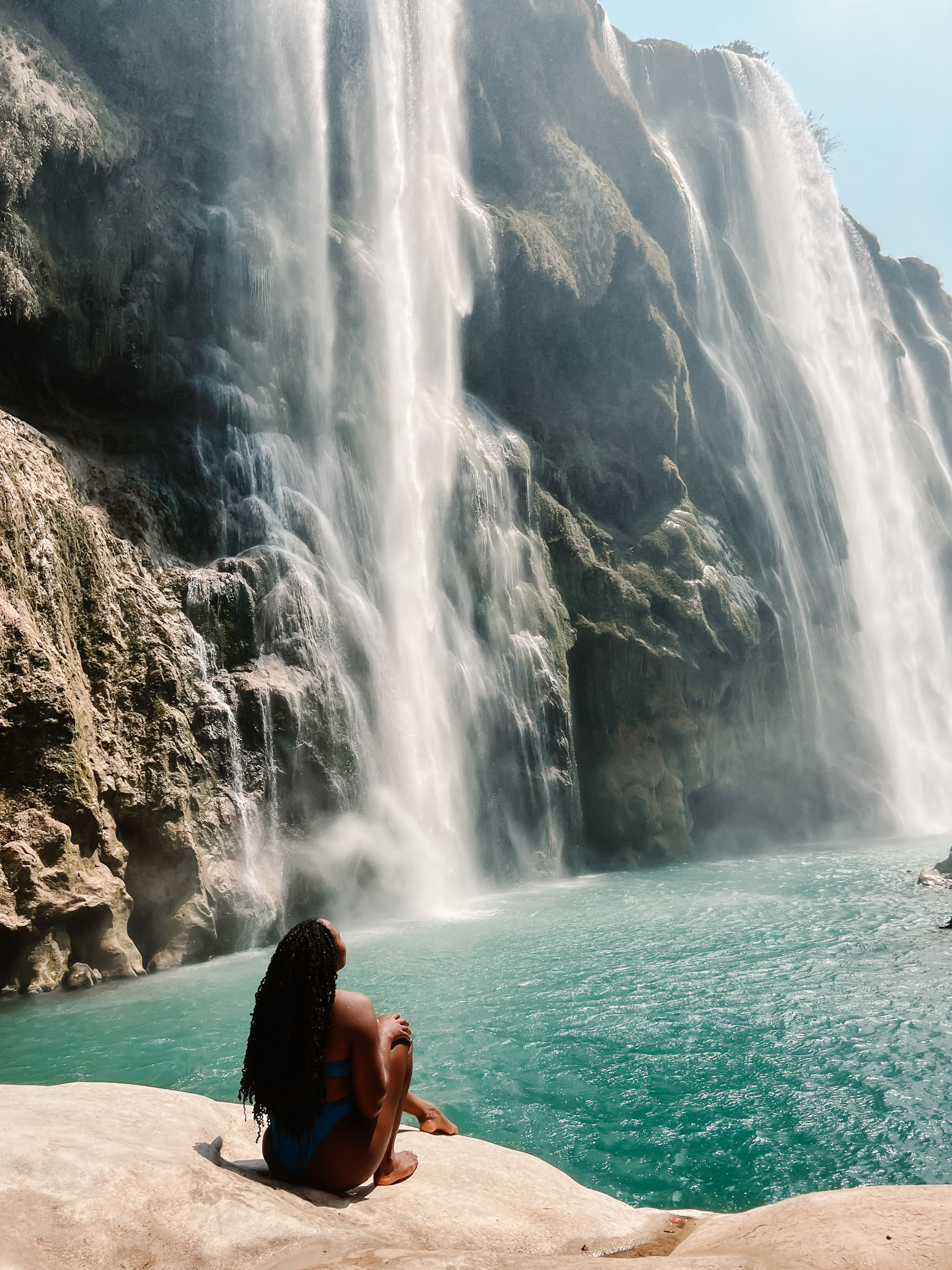 Sitting at the bottom of Cascada de Tamul in Huasteca Potosina Mexico