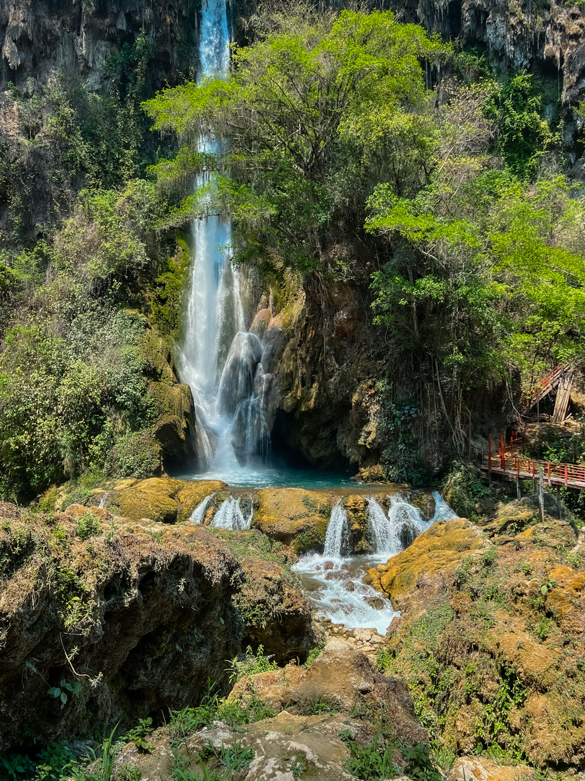 A photo of cascada de aguacate waterfall cascading down, one of the best waterfalls in Mexico.